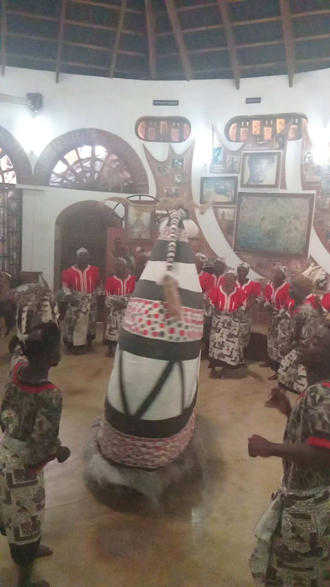Malawian cultural dancers in red and printed cloth