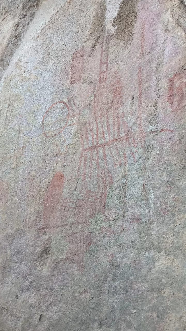 Faded red ochre paintings on a Chongoni granite shelter wall