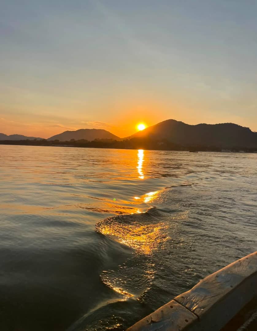 Golden sunset over Lake Malawi seen from a wooden boat
